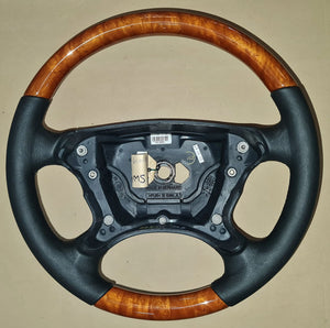 Steering wheels refurbished from classic wood/leather to carbon fibre